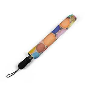 Colorful umbrella cover with a pattern of round shapes on a white background