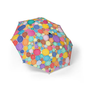 Colorful umbrella with a pattern of multicolored circles on a white background