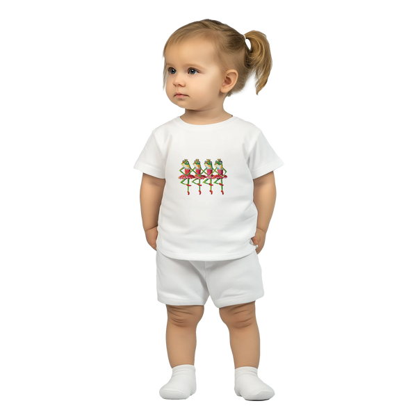 Child wearing a white t-shirt and shorts set with a colourful dancing frog princess design on a white background
